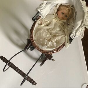 Vintage doll and wicker carriage